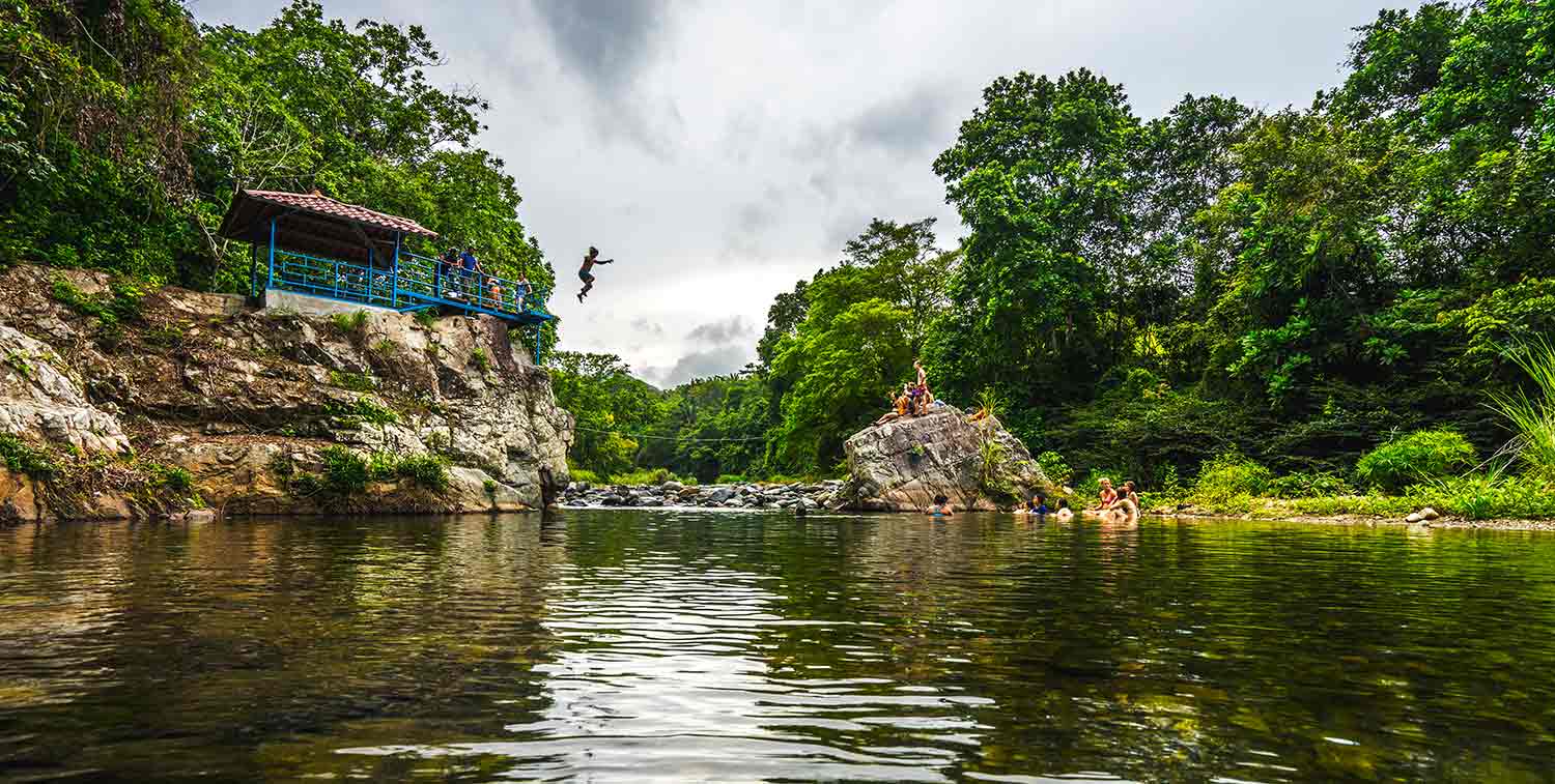 A jungle river with a small shelter on the bank