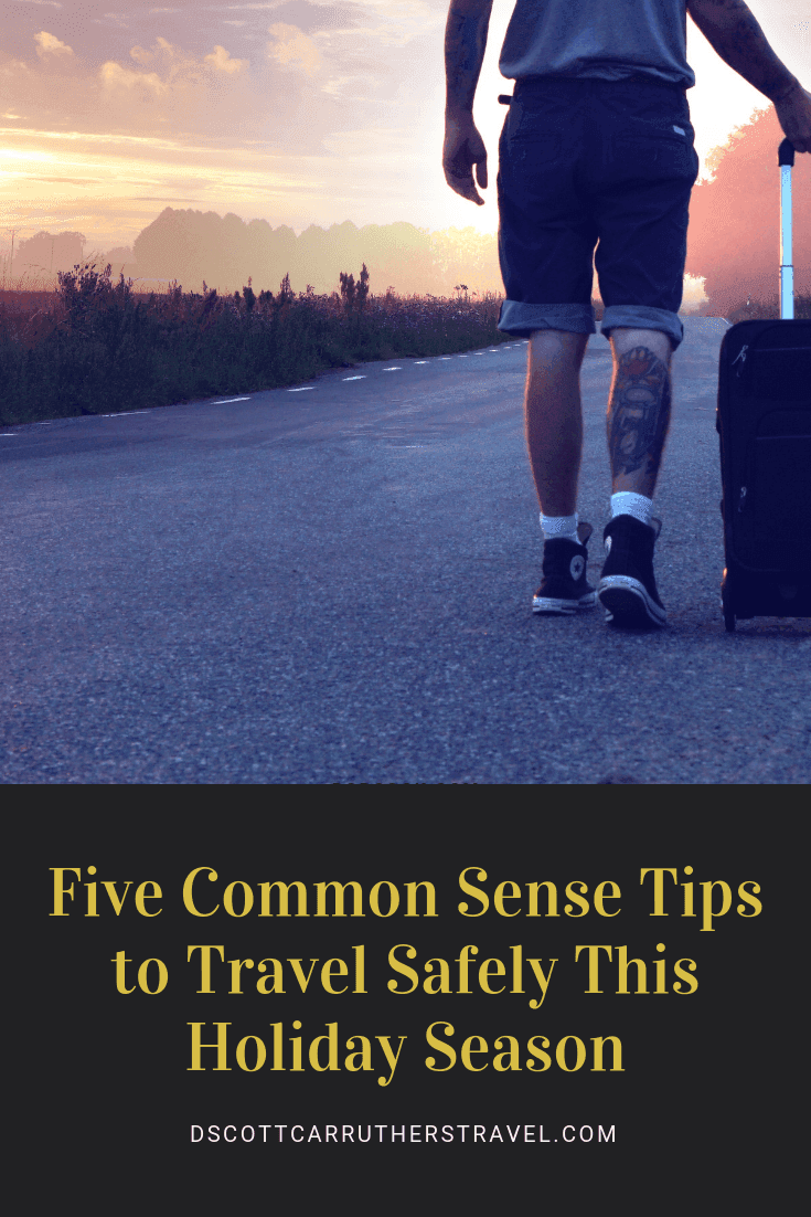 Graphic reading Five Common Sense Tips to Travel Safely This Holiday Season over a traveller walking a road with a suitcase